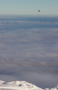 Tom Kelly > A hot air balloon floats quietly above the clouds, looking down on a snow and ice landscape from Åreskutan in Åre, Sweden.